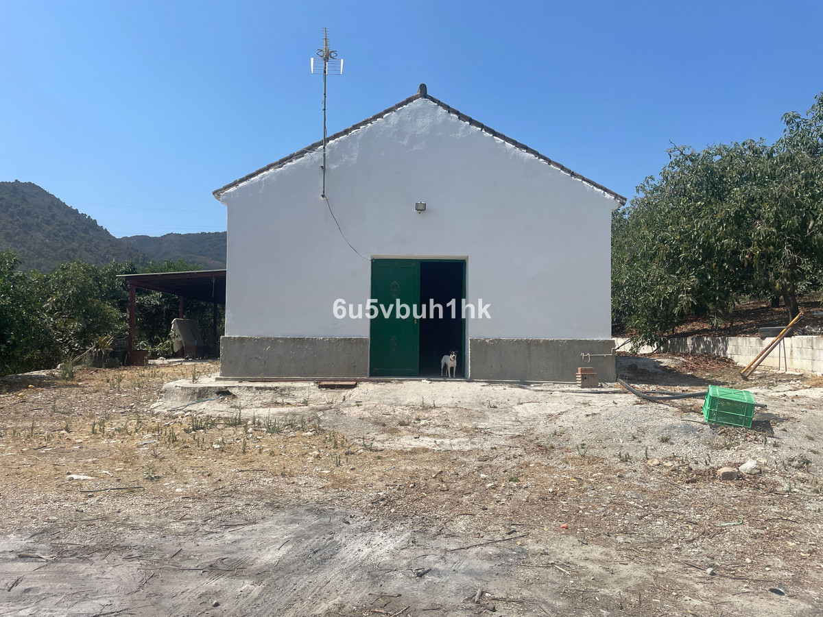 Grundstück in Coín